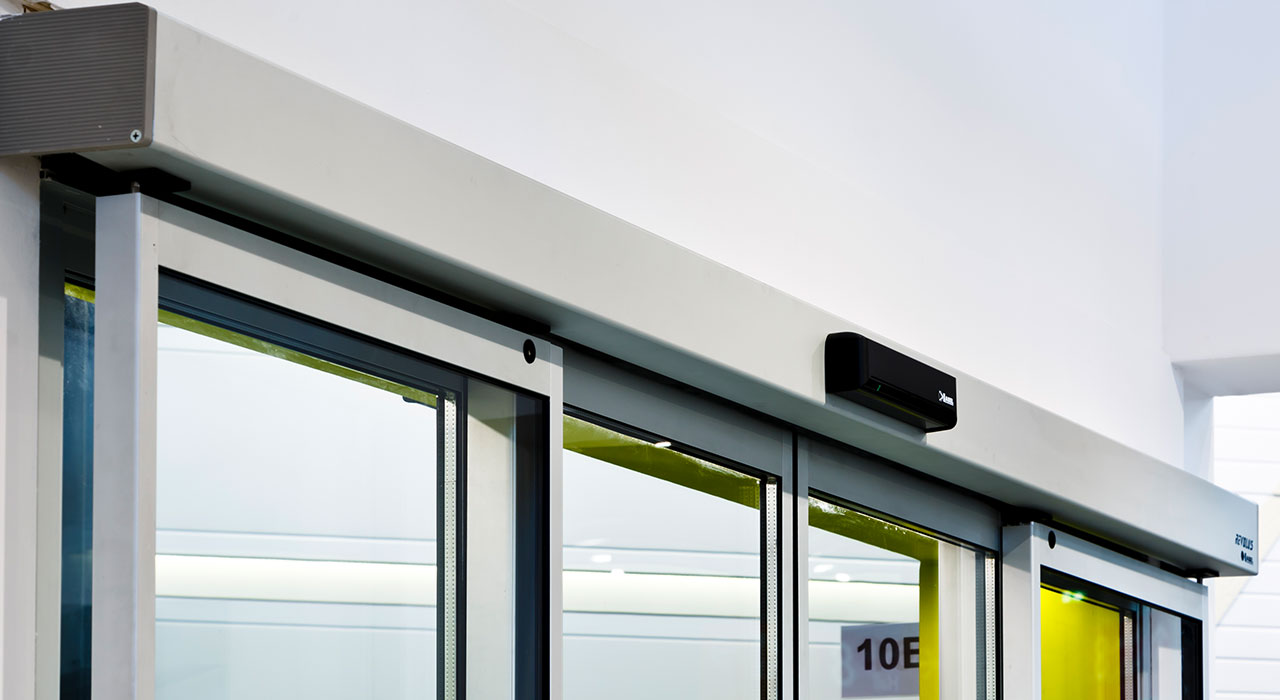 porte scorrevoli automatiche per negozi automazione Neptis